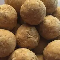 An image of Pumpkin Oat No Bake Dog Treats- a healthy and delicious recipe made with pumpkin puree, coconut oil, cinnamon, and oatmeal. Perfect for your furry friends!